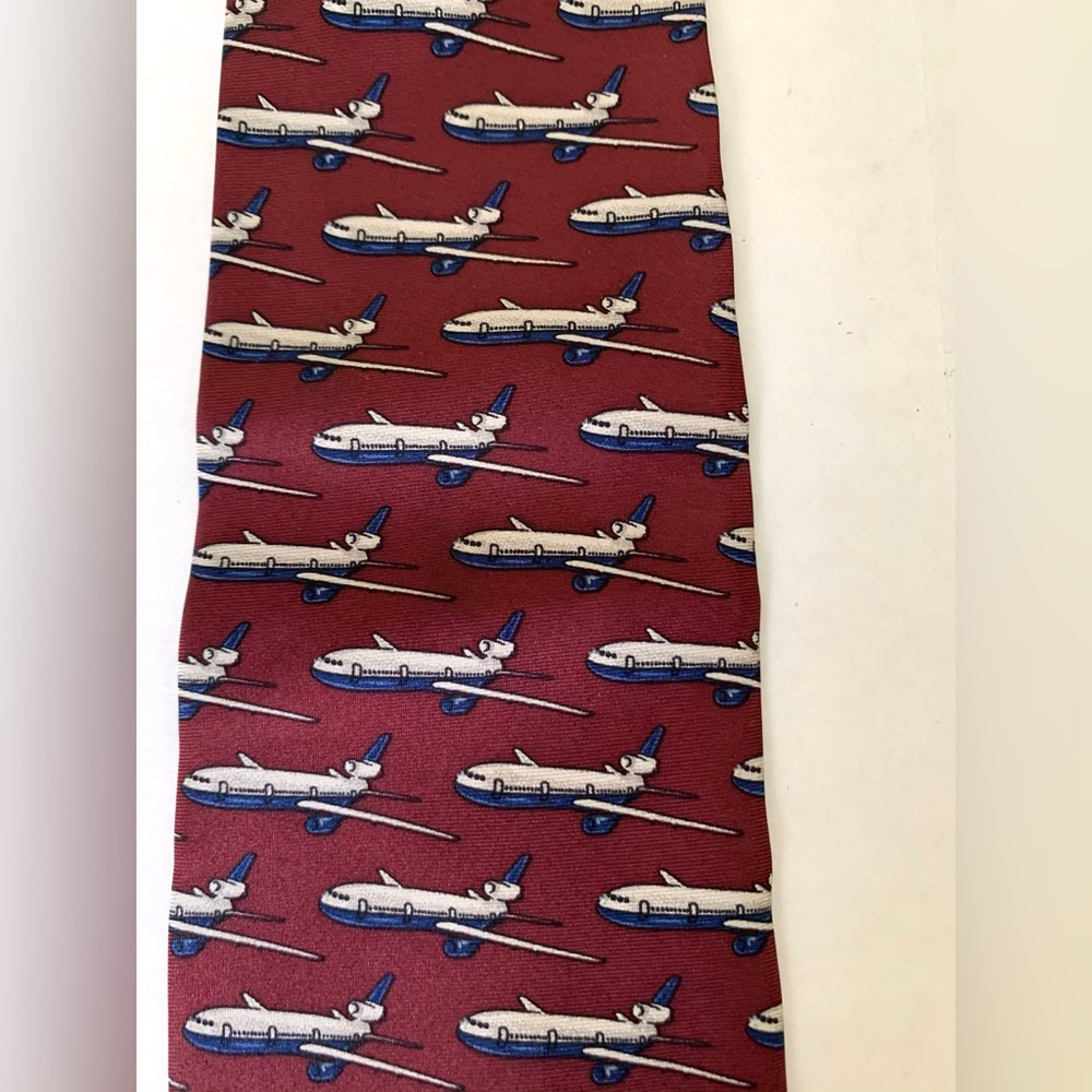 Men’s 100% silk burgundy color neck tie with pattern of white airplanes